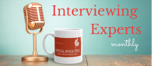 A microphone near a coffee cup. Text: Interviewing Experts